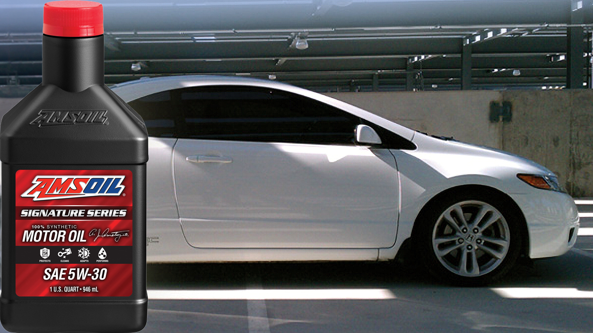 AMSOIL Signature Series 5W-30 quart beside a silver Honda Civic coupe