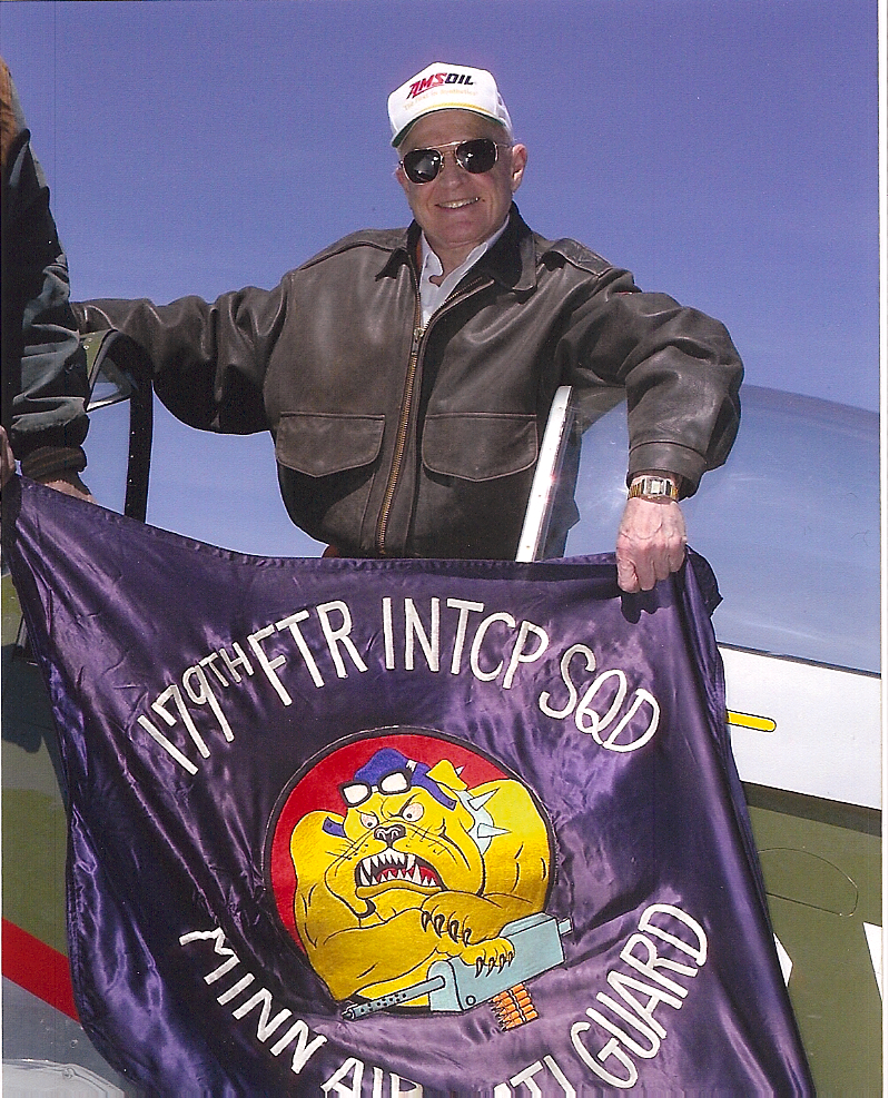 Al Amatuzio holding his Air National Guard fighter squadron flag