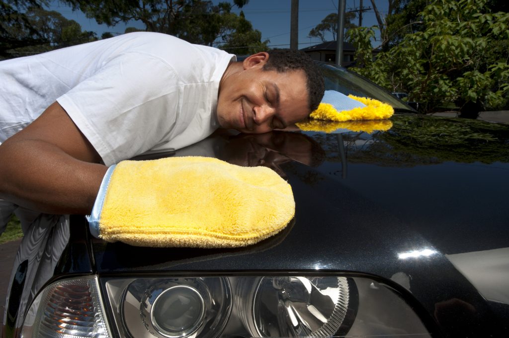 Man washing and loving his bmw car