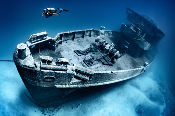 scuba diver exploring a shipwreck