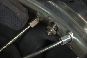 Thread nut on valve stem when installing a dirt bike tire.