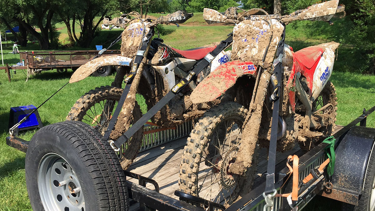 Dirt bikes covered in mud.