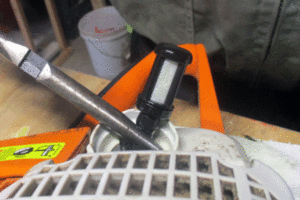 Clean the fuel filter to help solve chainsaw starting problems. 