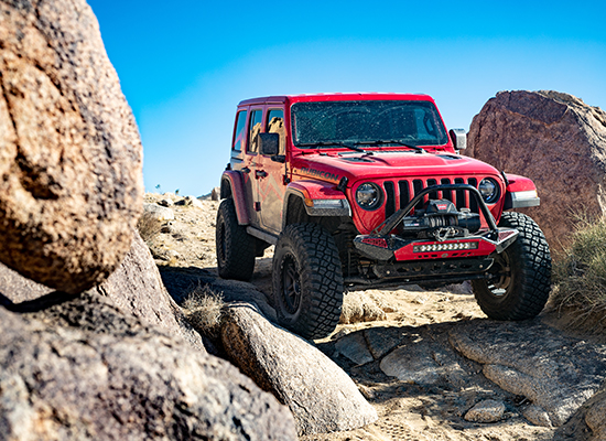 Jeep navigating rugged terrain.