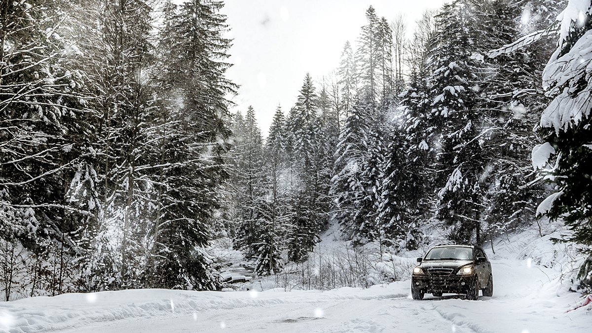 Car on remote winter road.
