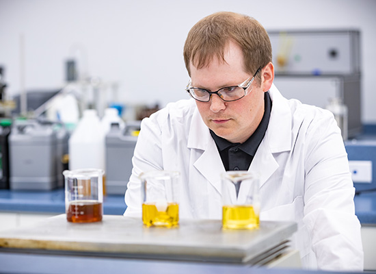 A chemist compares formulations in the AMSOIL chemical lab.