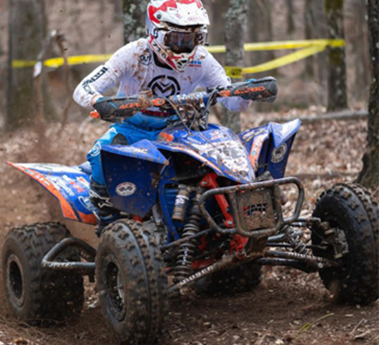 Logan Steele navigates a trail on his four-wheeler.