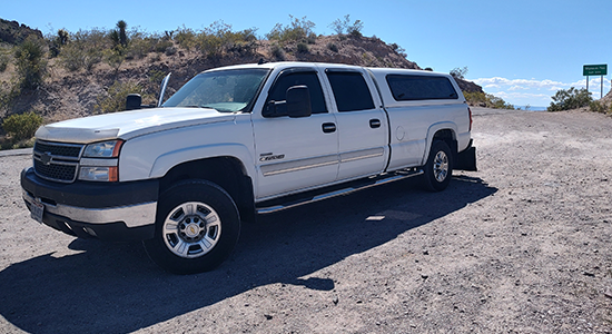 Chevrolet Duramax truck with over 1-million miles is parked next to a road.