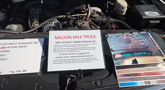 A sign on a Chevrolet Duramax pickup truck displays the total miles on the vehicle, which well exceeds 1-million.