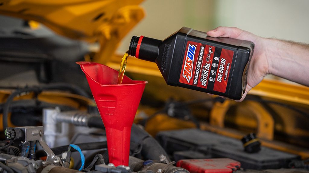 AMSOIL Signature Series 100% Synthetic Motor Oil is installed in a vehicle.