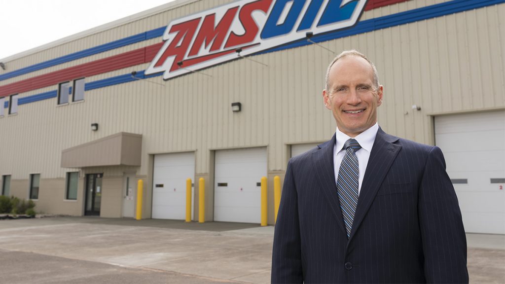 AMSOIL Chairman and CEO Alan Amatuzio stands in front of loading docks at the AMSOIL headquarters in Superior, Wis.